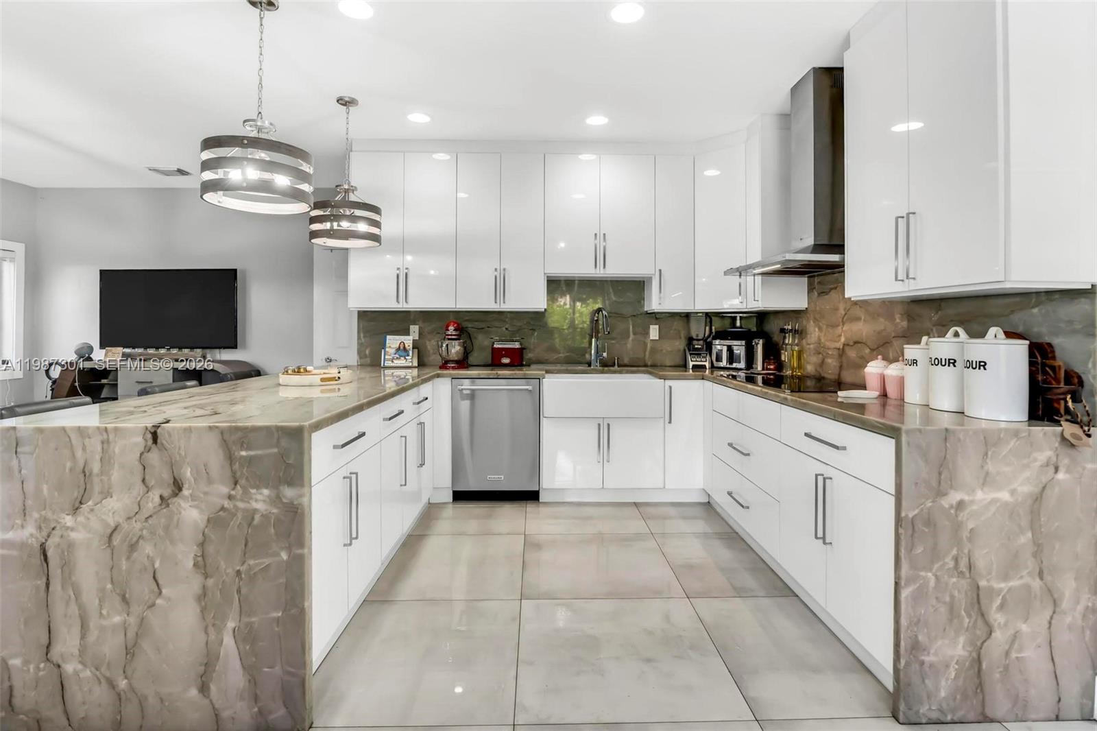 12940 Southwest 142nd Terrace Miami, FL 33186 - Photo 19 of 44 a kitchen with cabinets and window