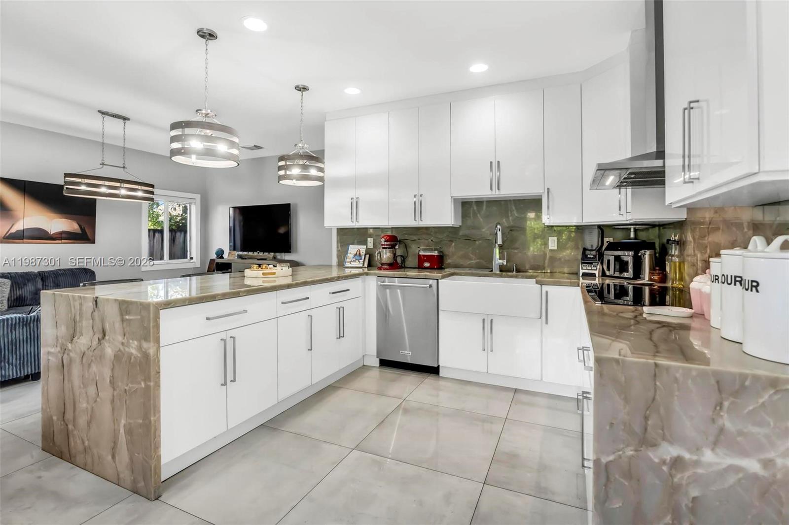 12940 Southwest 142nd Terrace Miami, FL 33186 - Photo 20 of 44 a kitchen with cabinets and window