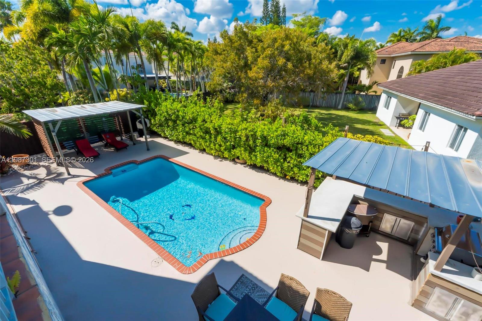 12940 Southwest 142nd Terrace Miami, FL 33186 - Photo 30 of 44 a view of yard from deck with patio
