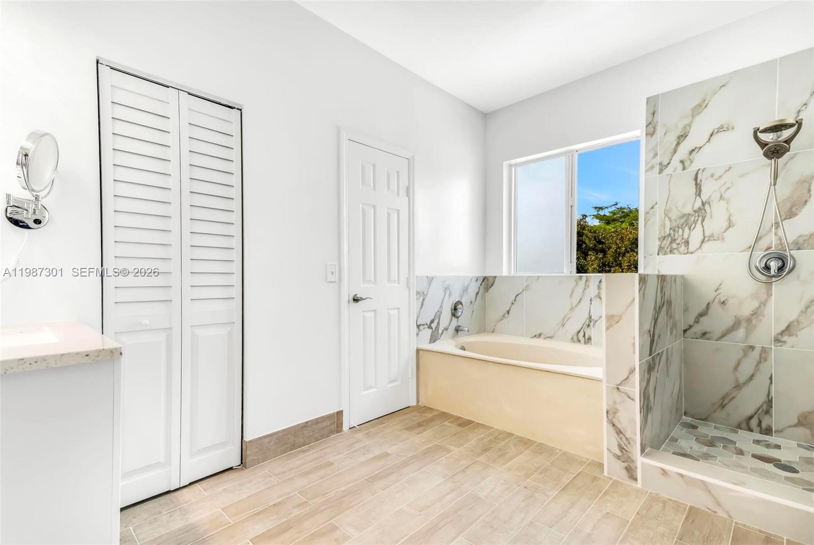 12940 Southwest 142nd Terrace Miami, FL 33186 - Photo 31 of 44 a living room with a couch and a window