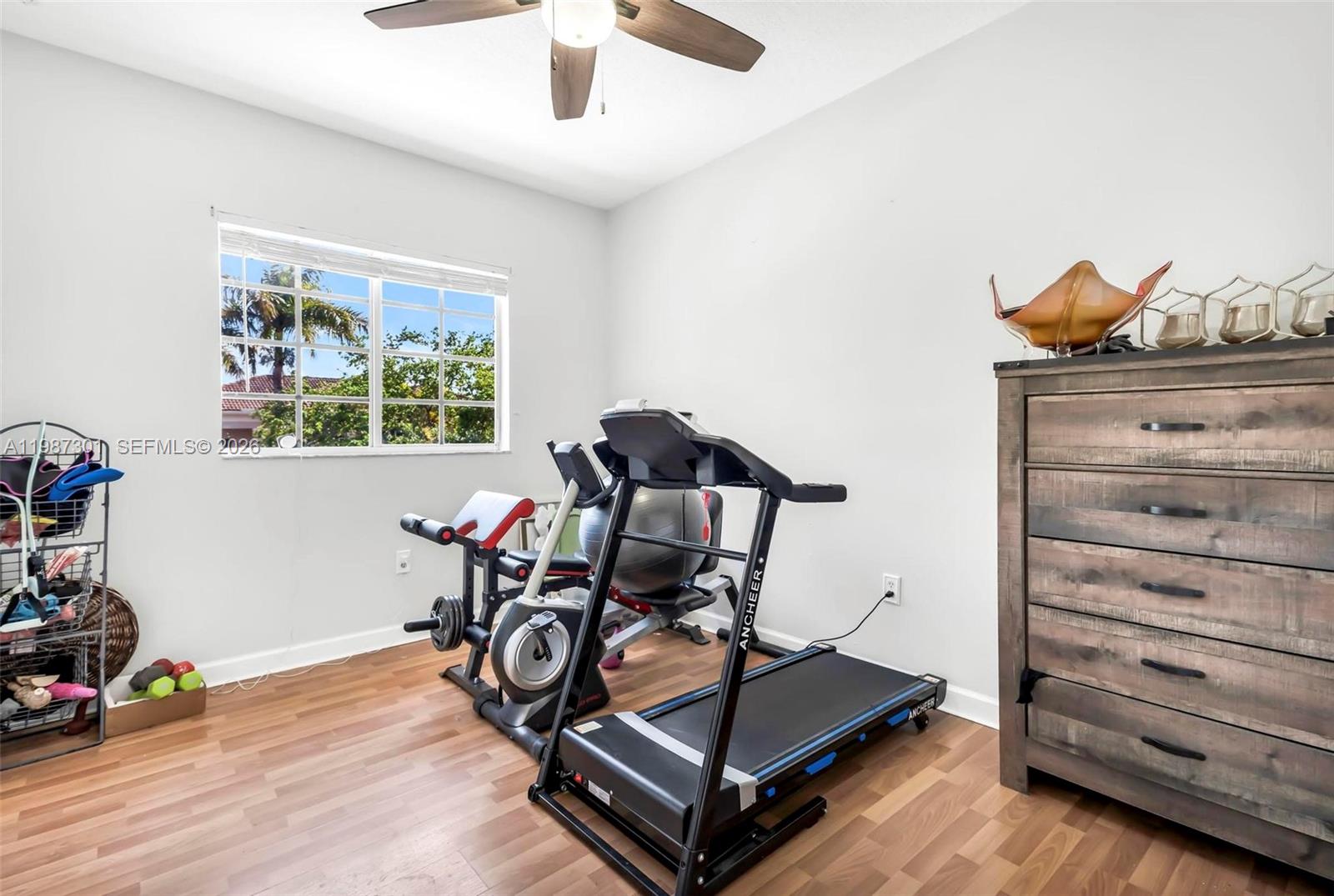 12940 Southwest 142nd Terrace Miami, FL 33186 - Photo 35 of 44 a view of a room with gym equipment