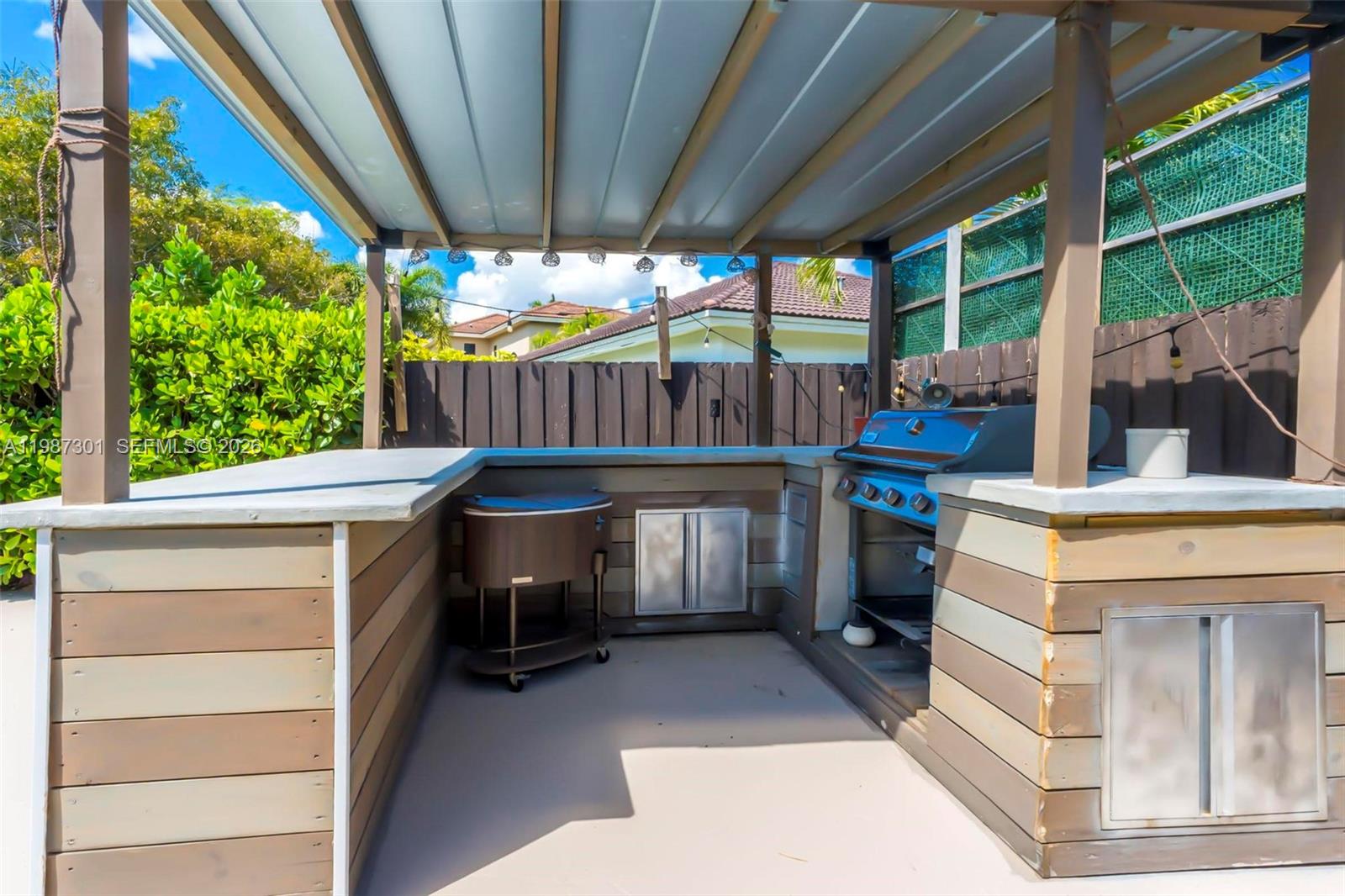 12940 Southwest 142nd Terrace Miami, FL 33186 - Photo 42 of 44 a view of an outdoor kitchen