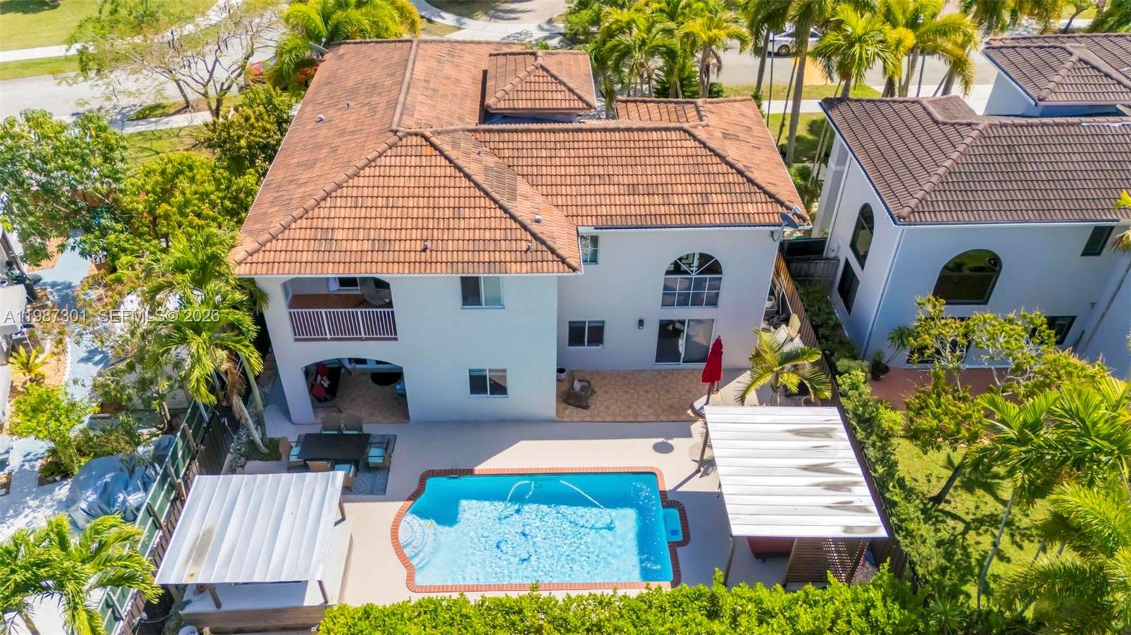 12940 Southwest 142nd Terrace Miami, FL 33186 - Photo 6 of 44 swimming pool view with seating space