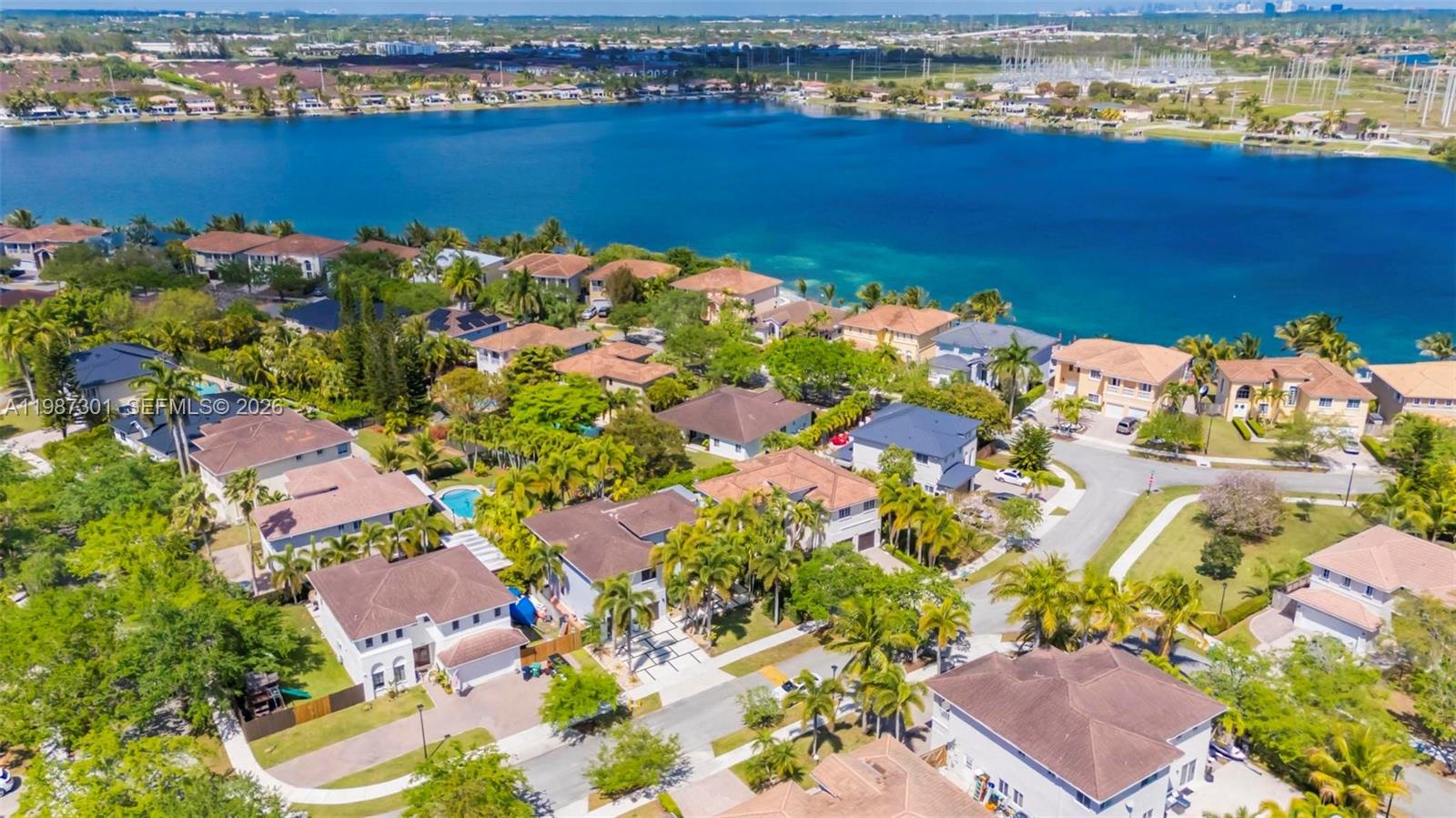 12940 Southwest 142nd Terrace Miami, FL 33186 - Photo 7 of 44 an aerial view of a houses with a lake view