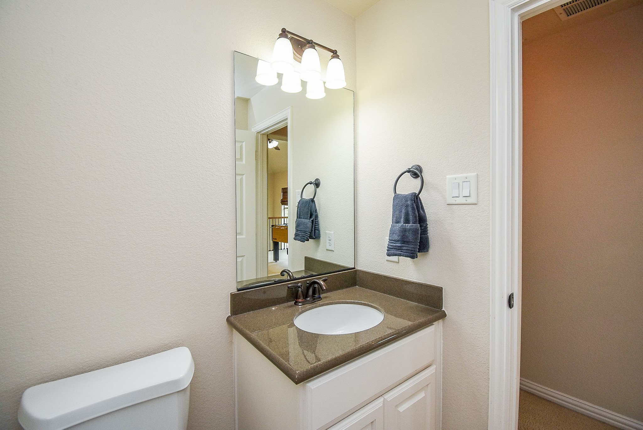 27427 Guthrie Ridge Lane Katy, TX 77494 - Photo 41 of 48 a bathroom with a toilet sink and mirror
