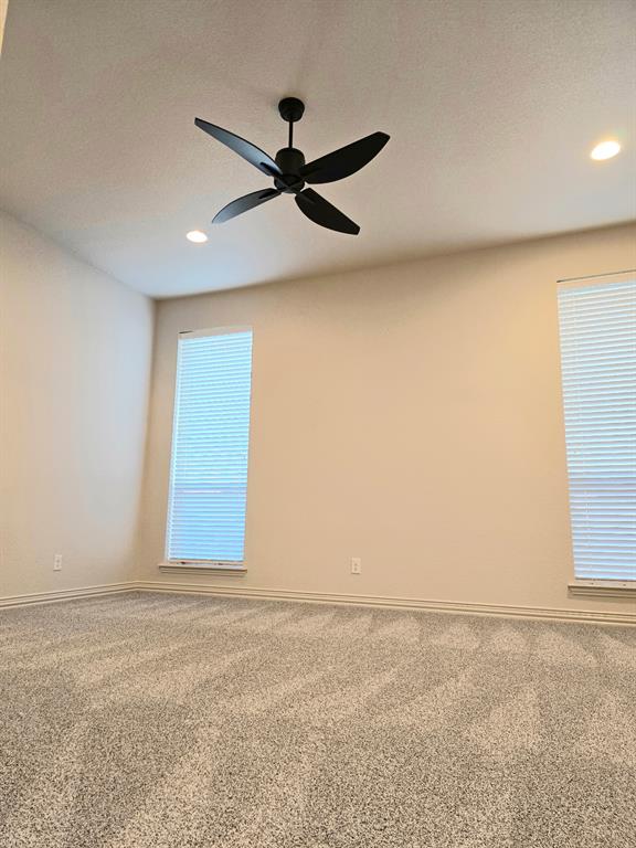 7 Southfork Court Wichita Falls, TX 76310 - Photo 20 of 27 an empty room with windows and fan