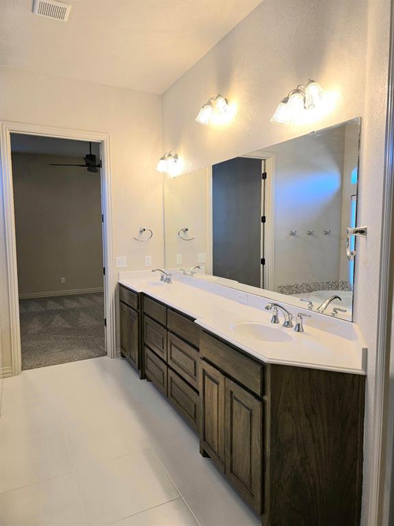 7 Southfork Court Wichita Falls, TX 76310 - Photo 22 of 27 a spacious bathroom with a double vanity sink mirror and double