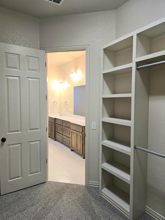 7 Southfork Court Wichita Falls, TX 76310 - Photo 26 of 27 a view of walk in closet with empty racks