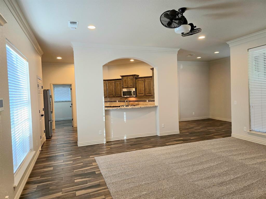 7 Southfork Court Wichita Falls, TX 76310 - Photo 5 of 27 a view of a hallway view with wooden floor and staircase