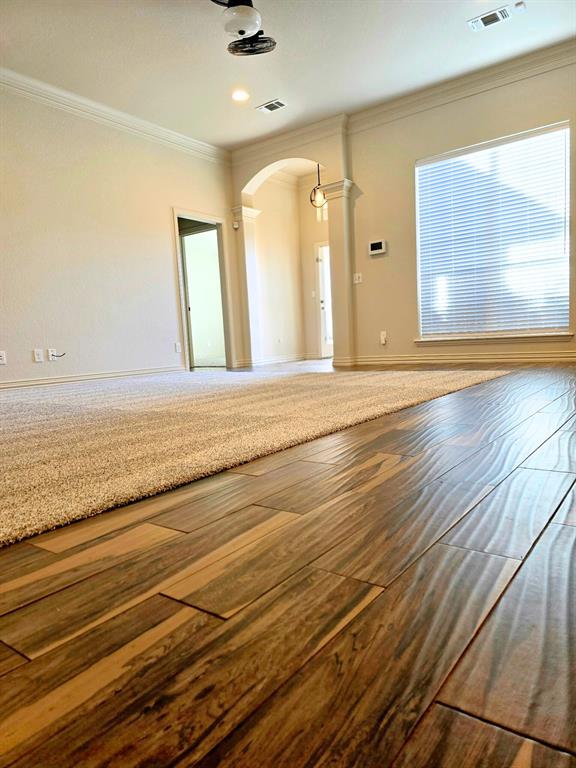 7 Southfork Court Wichita Falls, TX 76310 - Photo 6 of 27 a view of a room with wooden floor and windows