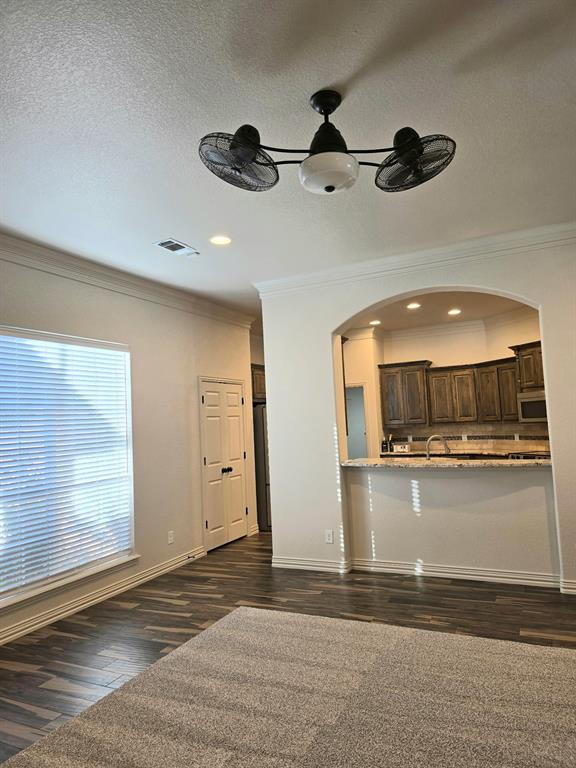 7 Southfork Court Wichita Falls, TX 76310 - Photo 7 of 27 a living room with a ceiling fan and a rug