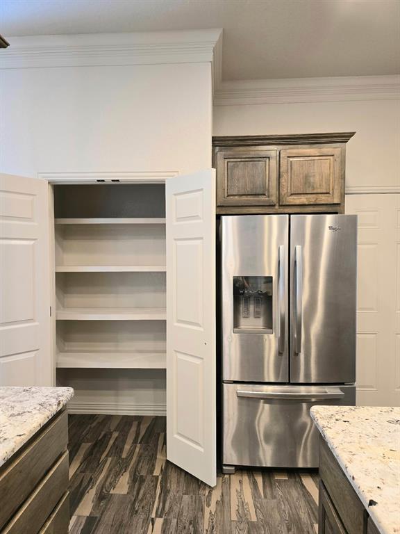 7 Southfork Court Wichita Falls, TX 76310 - Photo 8 of 27 a kitchen with a refrigerator and countertop
