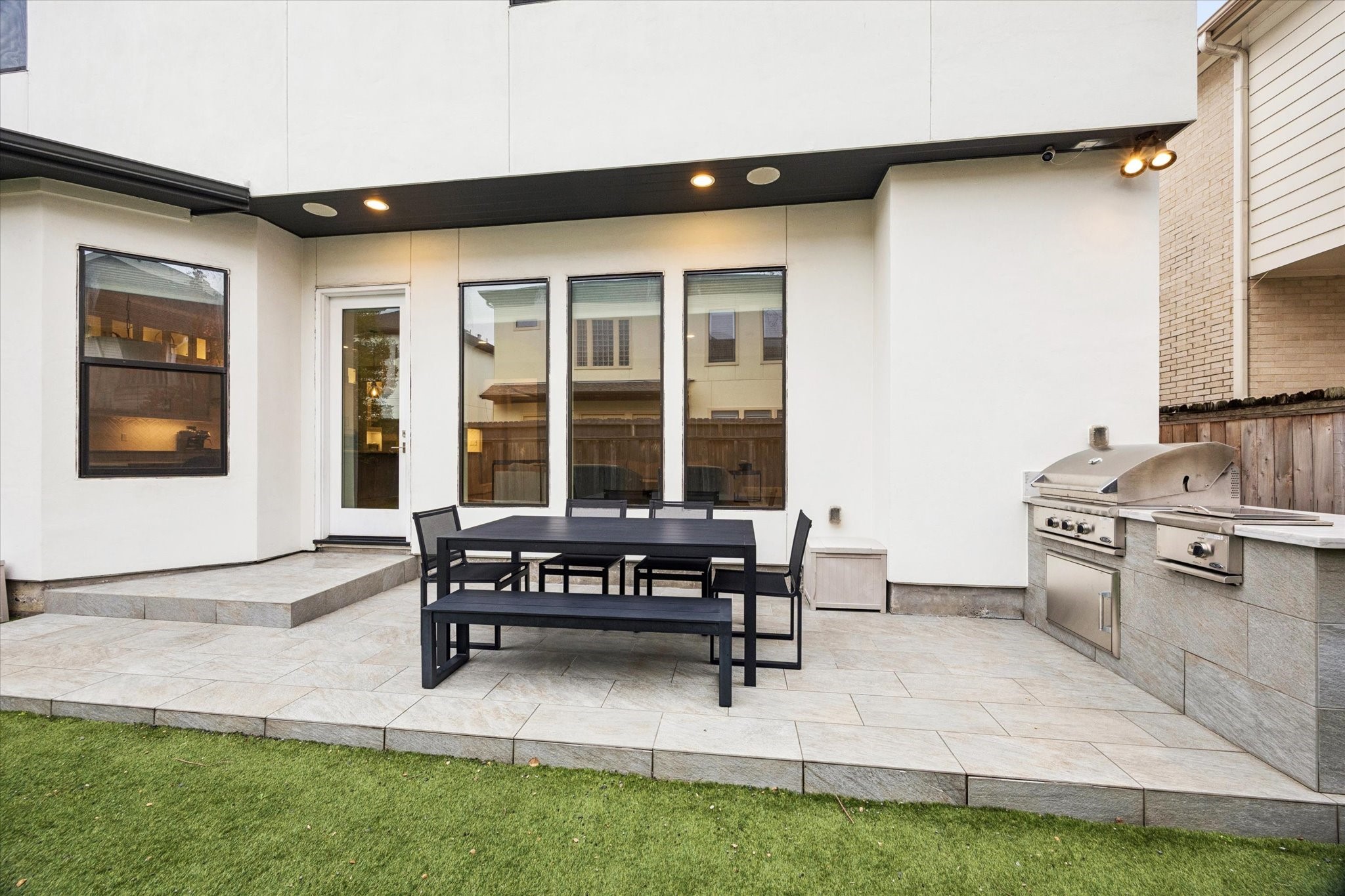 4108 Sunset Boulevard Houston, TX 77005 - Photo 20 of 21 Perfect entertaining backyard, focusing on blending a functional high-performance gas grill station with the low-maintenance aesthetics of artificial turf grass.