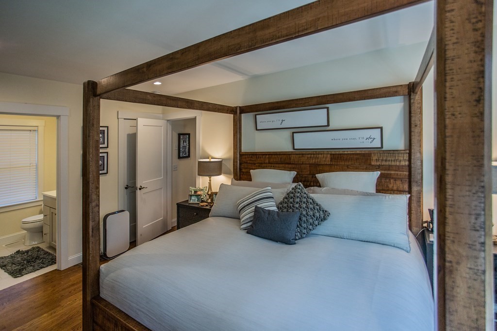 1301 Service Road Barnstable, MA 02668 - Photo 13 of 40 a bedroom with a bed and wooden floor