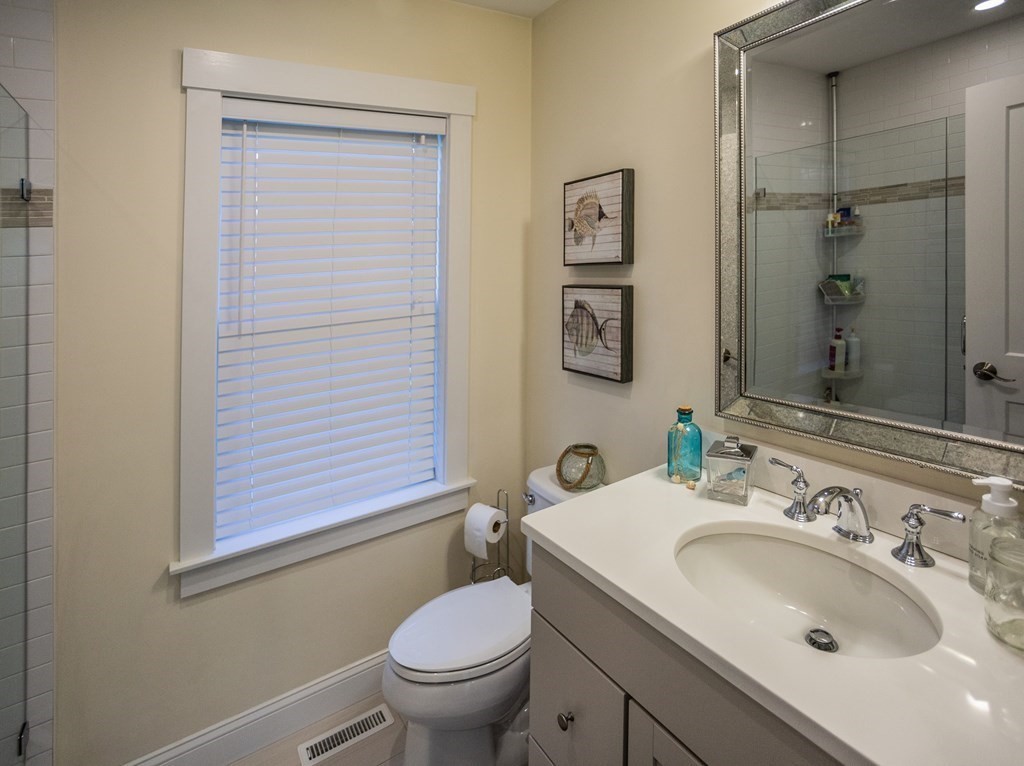 1301 Service Road Barnstable, MA 02668 - Photo 14 of 40 a bathroom with a sink toilet and shower
