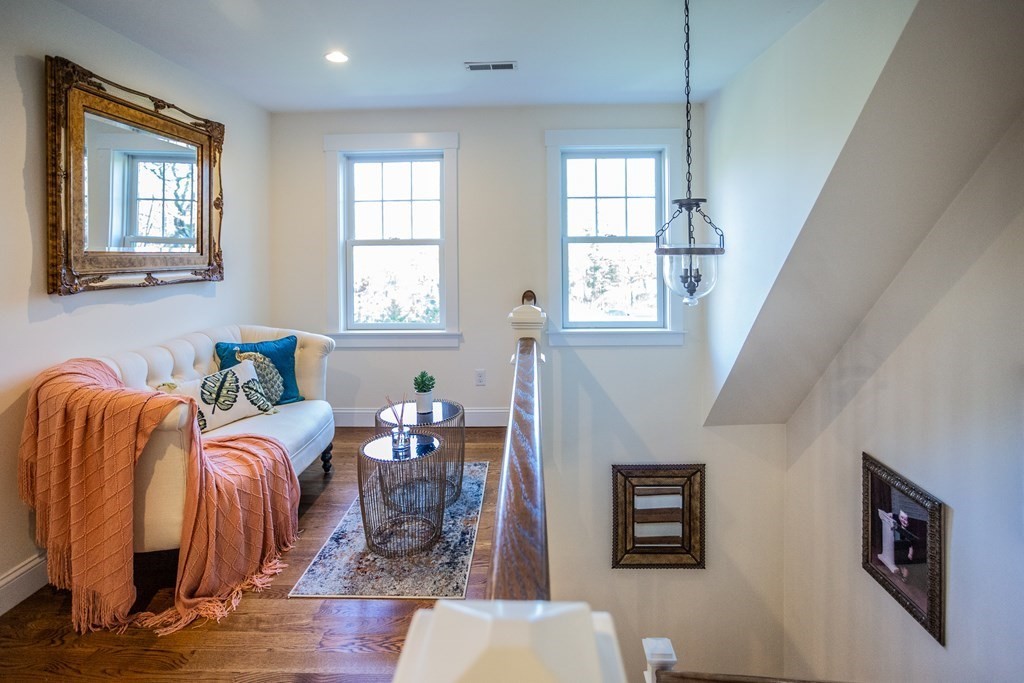 1301 Service Road Barnstable, MA 02668 - Photo 20 of 40 a living room with fireplace furniture and a window