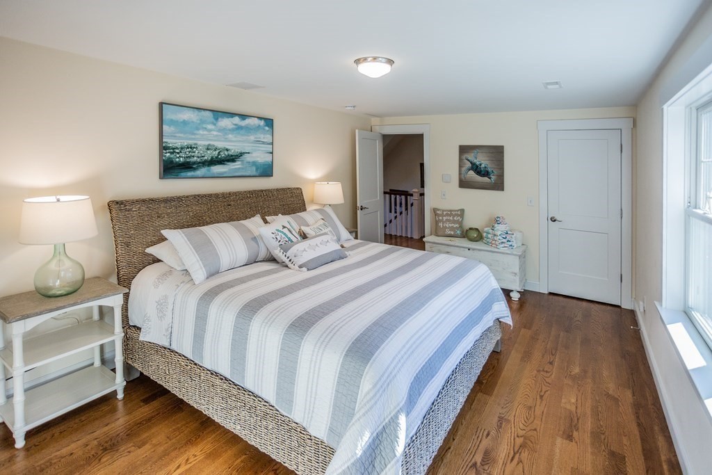 1301 Service Road Barnstable, MA 02668 - Photo 23 of 40 a bedroom with bed and night stand