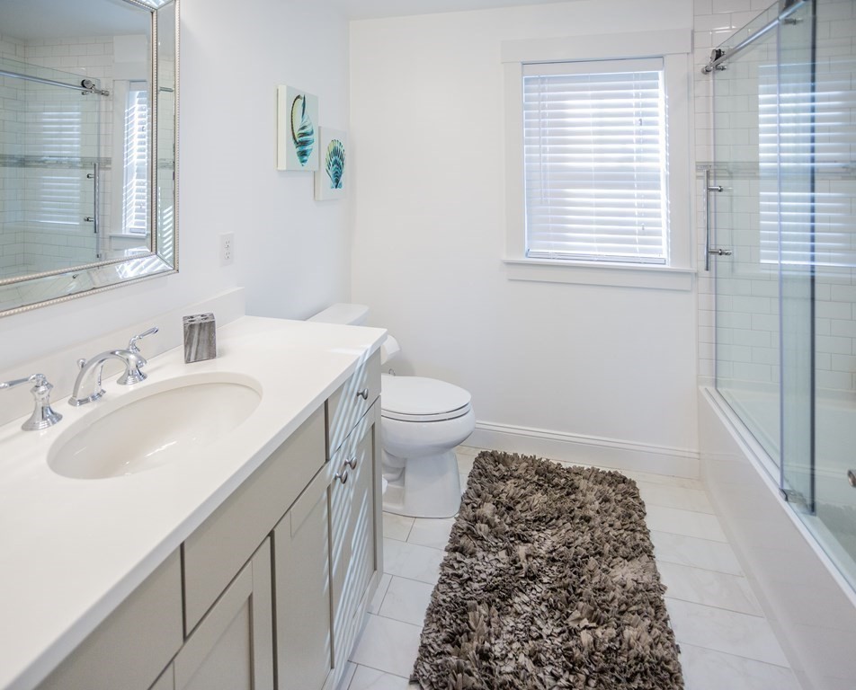 1301 Service Road Barnstable, MA 02668 - Photo 26 of 40 a bathroom with a sink and a toilet