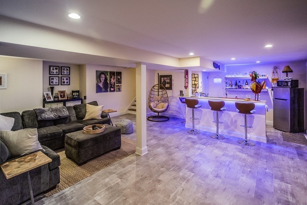 1301 Service Road Barnstable, MA 02668 - Photo 33 of 40 a living room with fireplace furniture and a large window