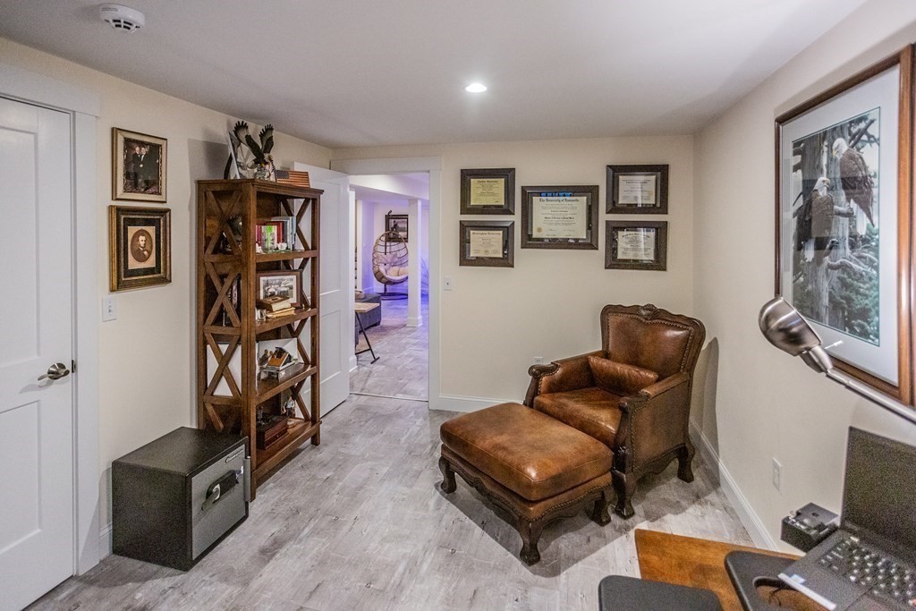 1301 Service Road Barnstable, MA 02668 - Photo 35 of 40 a living room with furniture gym equipment and a window