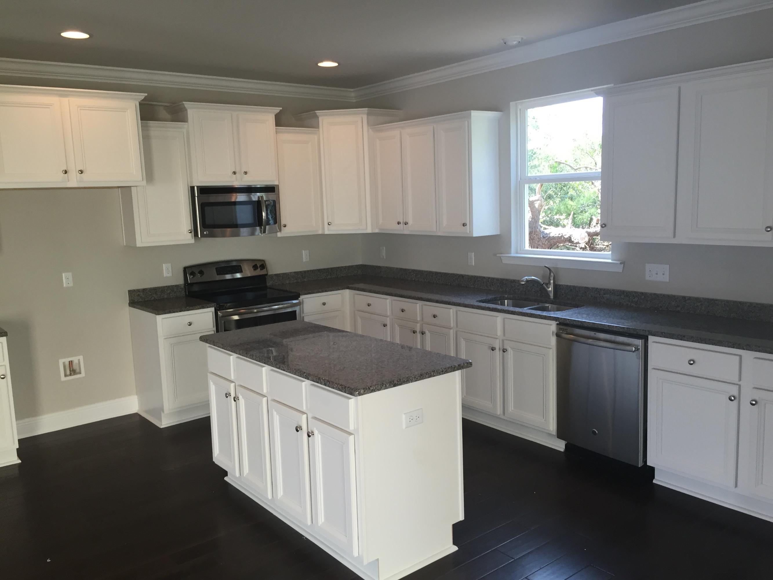 49 Grayling Way Inlet Beach, FL 32461 - Photo 7 of 10 a kitchen with white cabinets sink and appliances