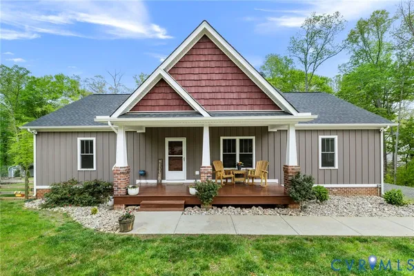 a front view of house with a garden and patio