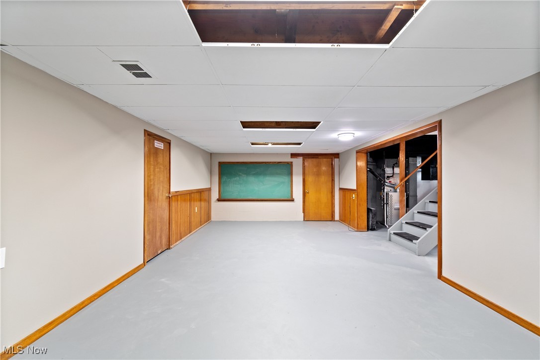 1716 Betz Road Akron, OH 44306 - Photo 21 of 28 Finished below grade area with a paneled ceiling and stairs