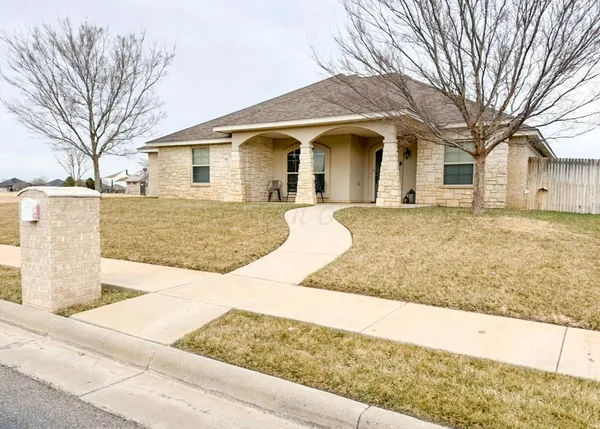 front view of a house with a yard