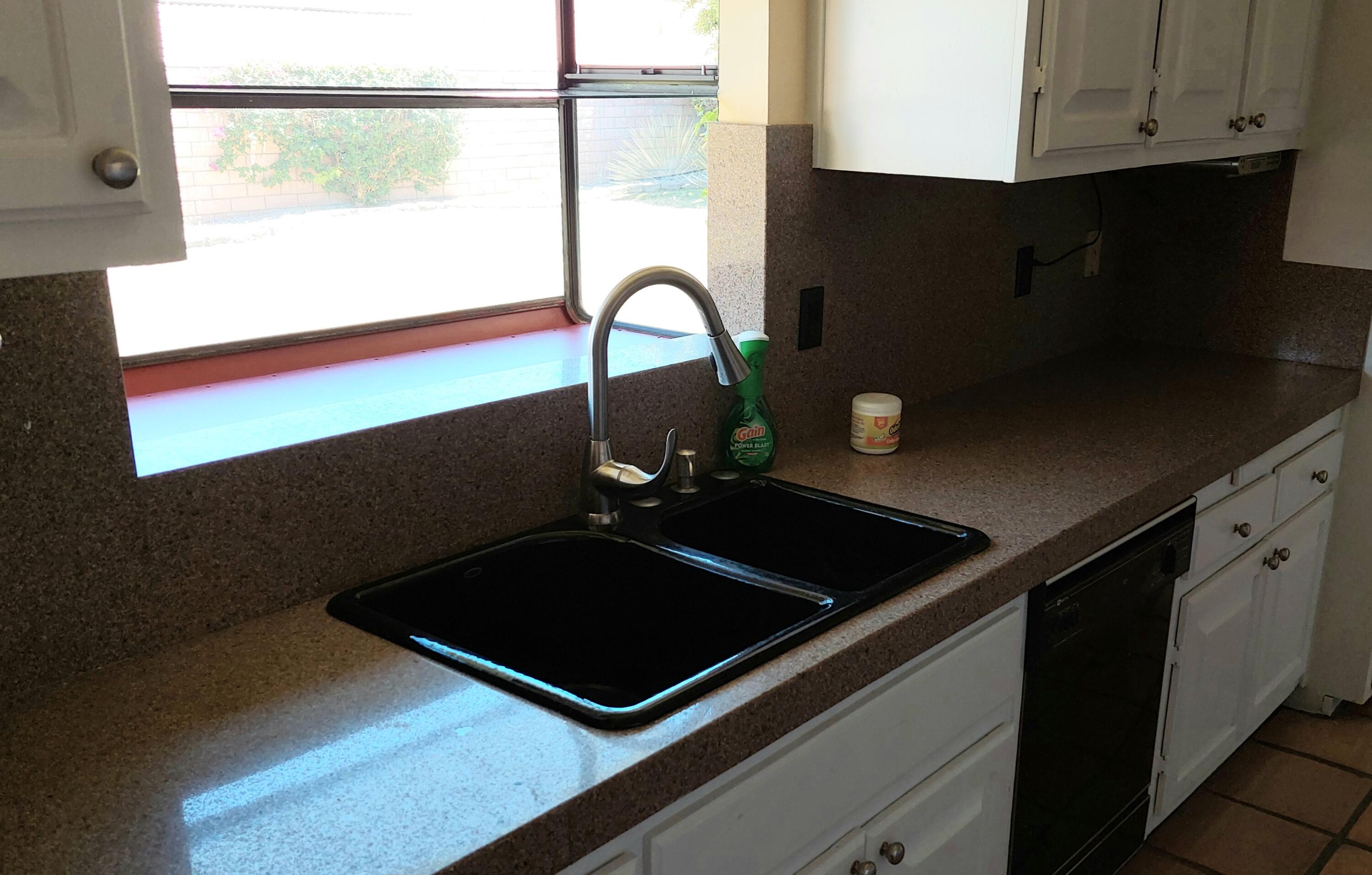 42710 Sandy Bay Road Bermuda Dunes, CA 92203 - Photo 13 of 37 a close view of a sink a counter space and utility room