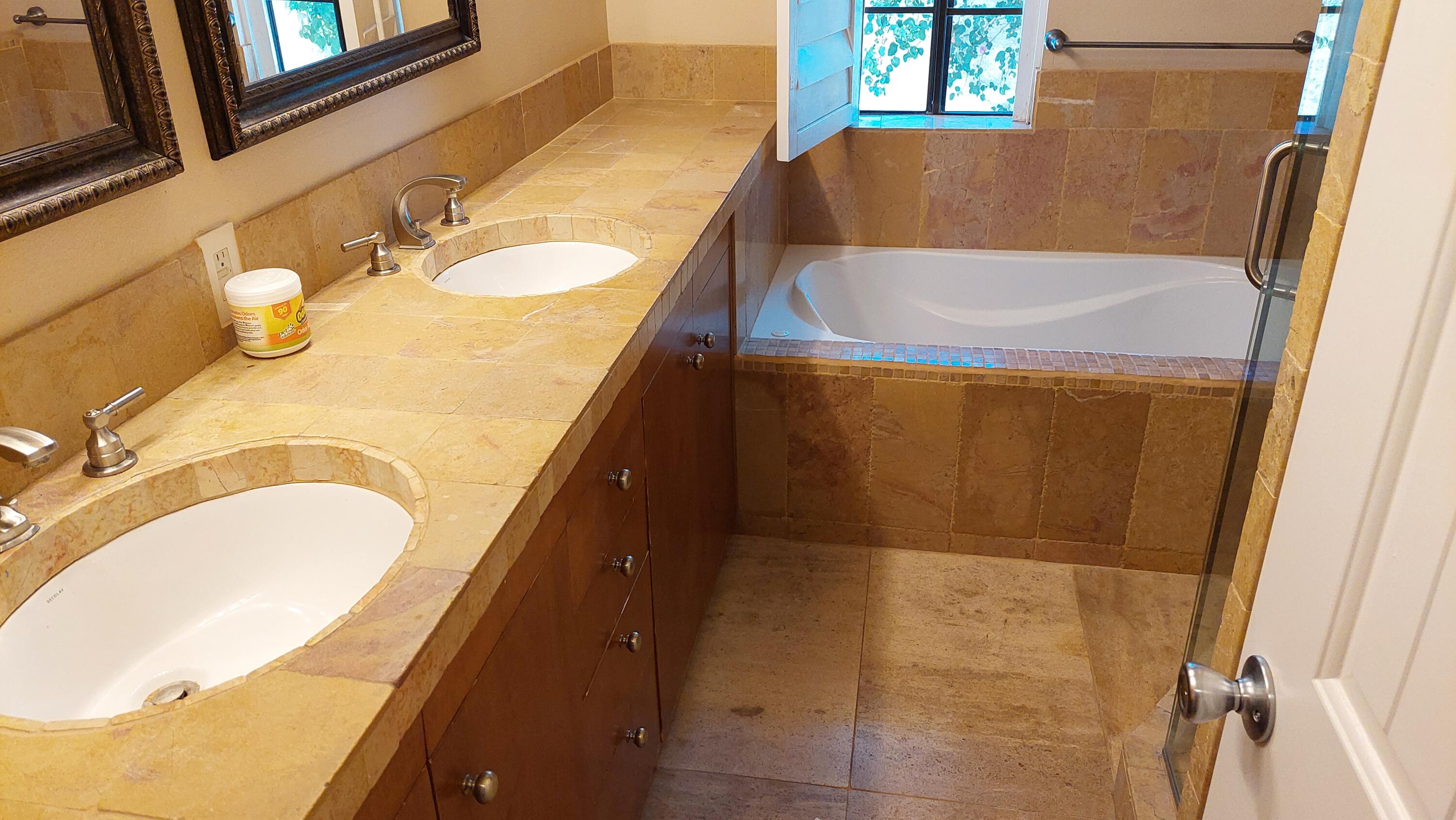 42710 Sandy Bay Road Bermuda Dunes, CA 92203 - Photo 17 of 37 a bathroom with a granite countertop sink and a mirror