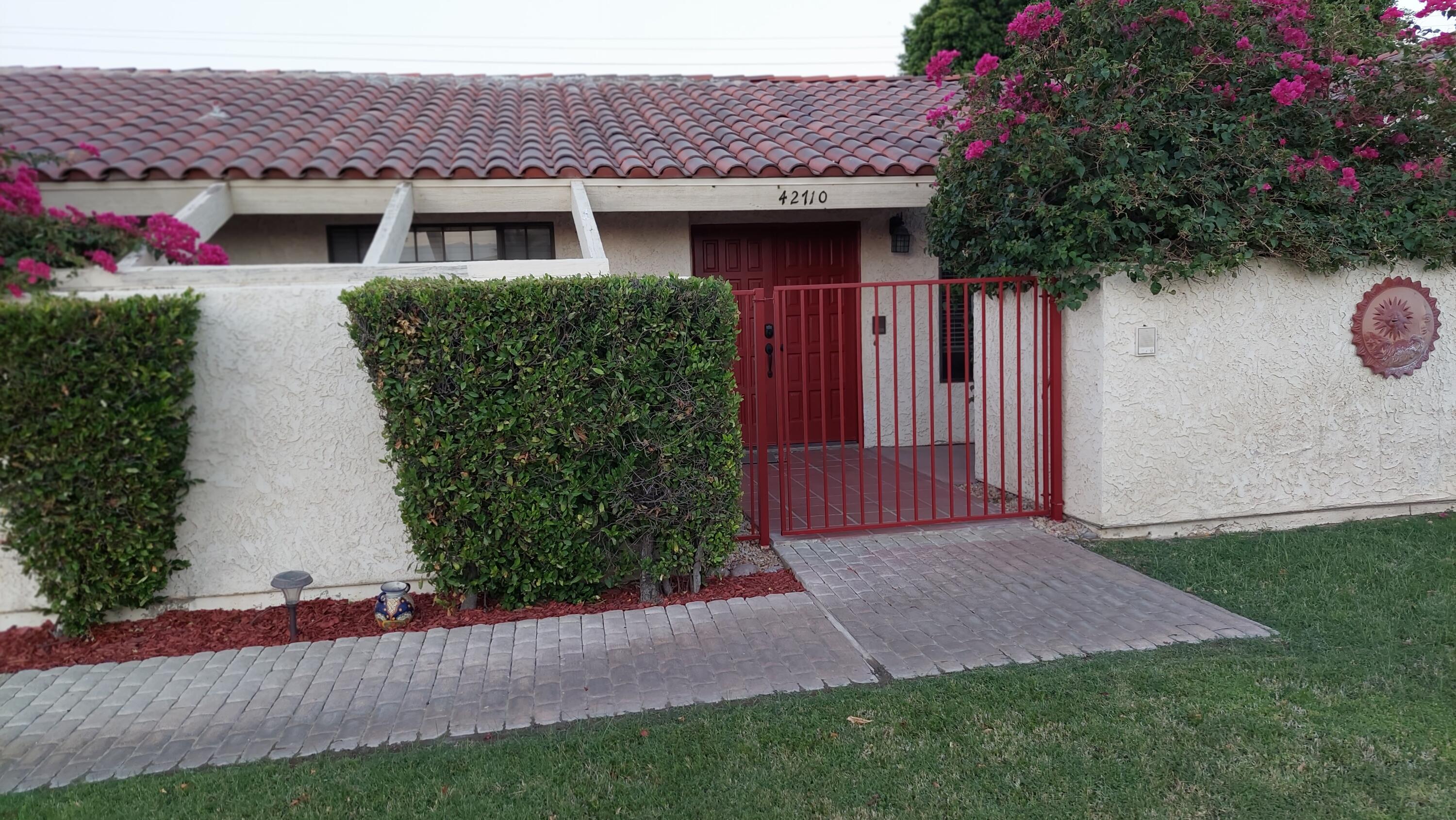 42710 Sandy Bay Road Bermuda Dunes, CA 92203 - Photo 3 of 37 a front view of a house with garden