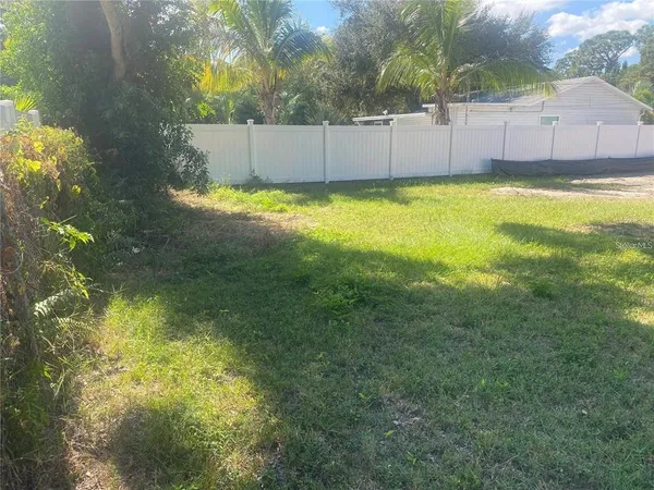 a view of a swimming pool and a yard
