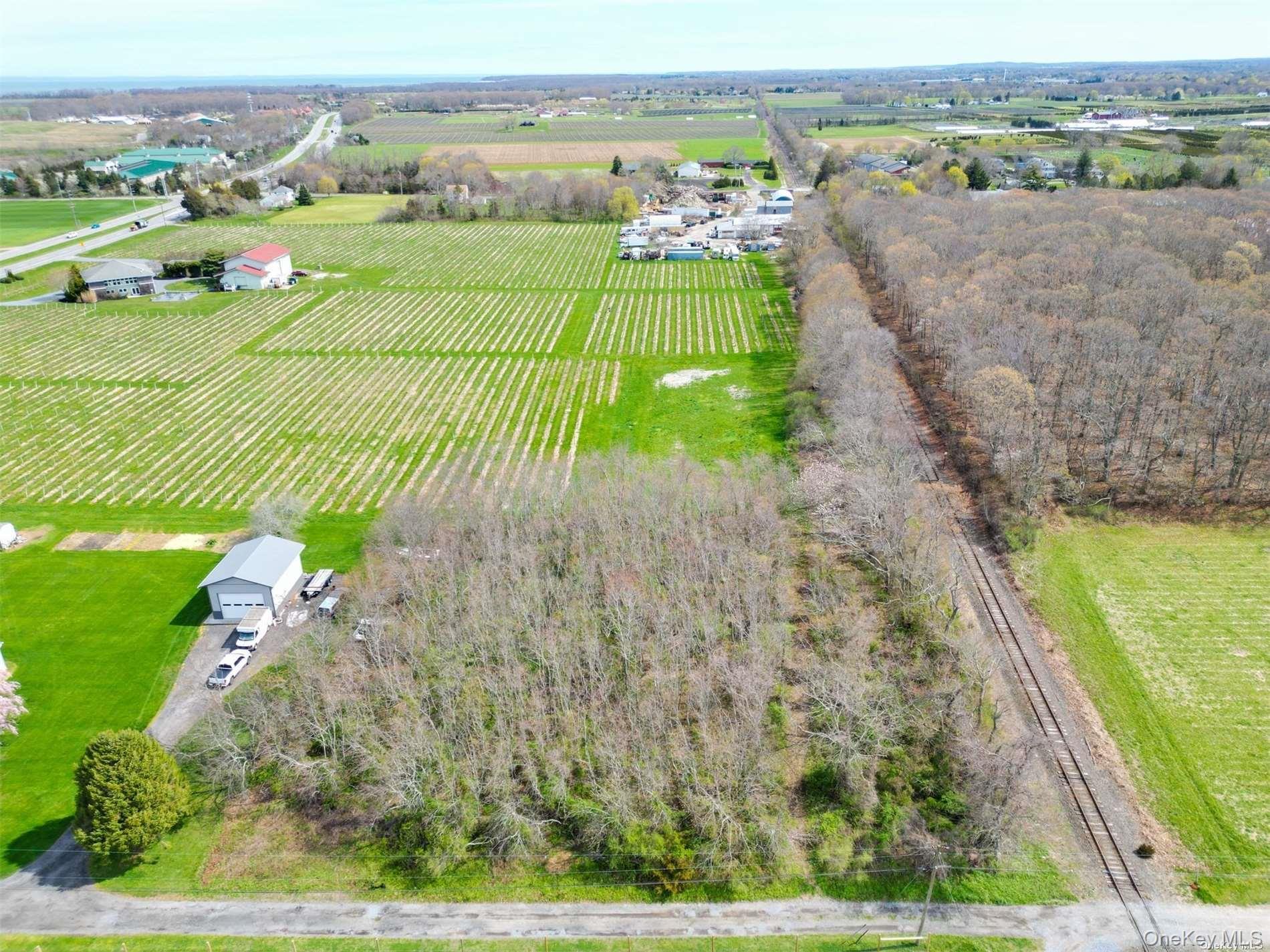 48 County Road Cutchogue, NY 11935 - Photo 2 of 9 an aerial view of a golf course with a big yard