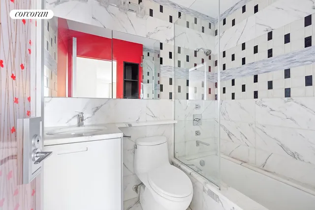 a bathroom with a bathtub and shower