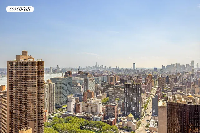 a bathroom with a sink a toilet and shower curtain