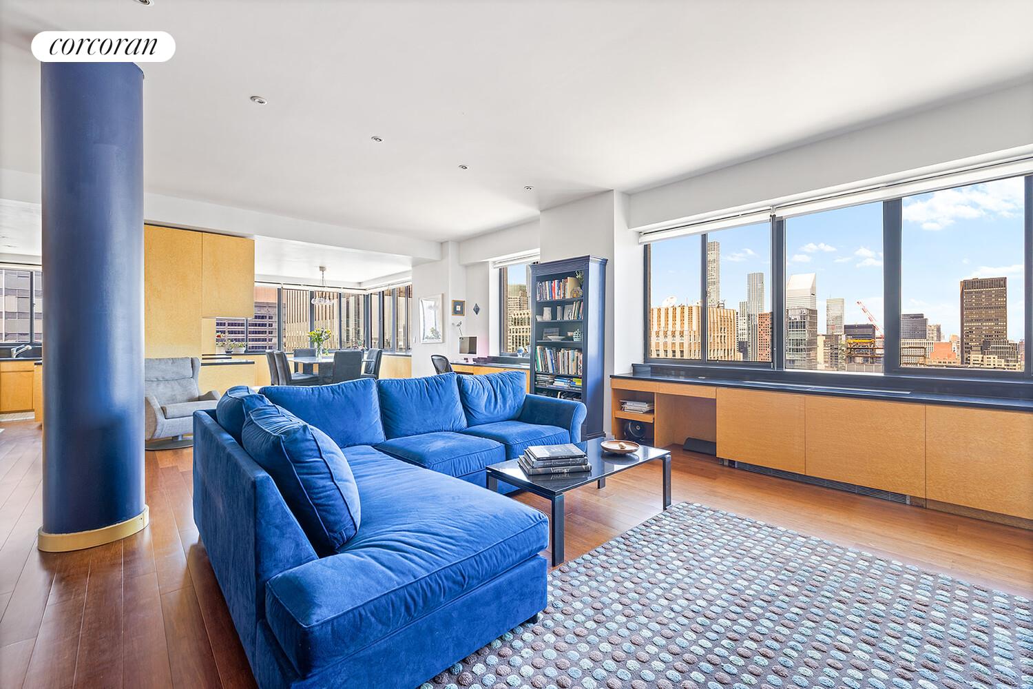 250 East 40th Street, Unit PH2A Manhattan, NY 10016 - Photo 4 of 25 a living room with furniture and a floor to ceiling window