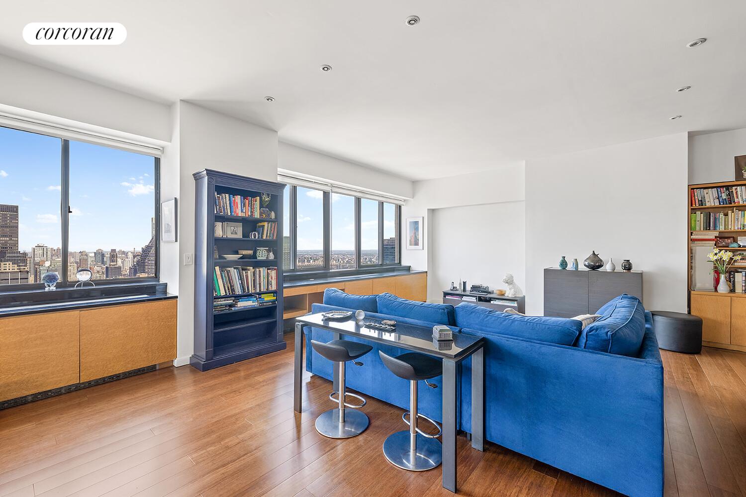 250 East 40th Street, Unit PH2A Manhattan, NY 10016 - Photo 5 of 25 a living room with furniture and a wooden floor