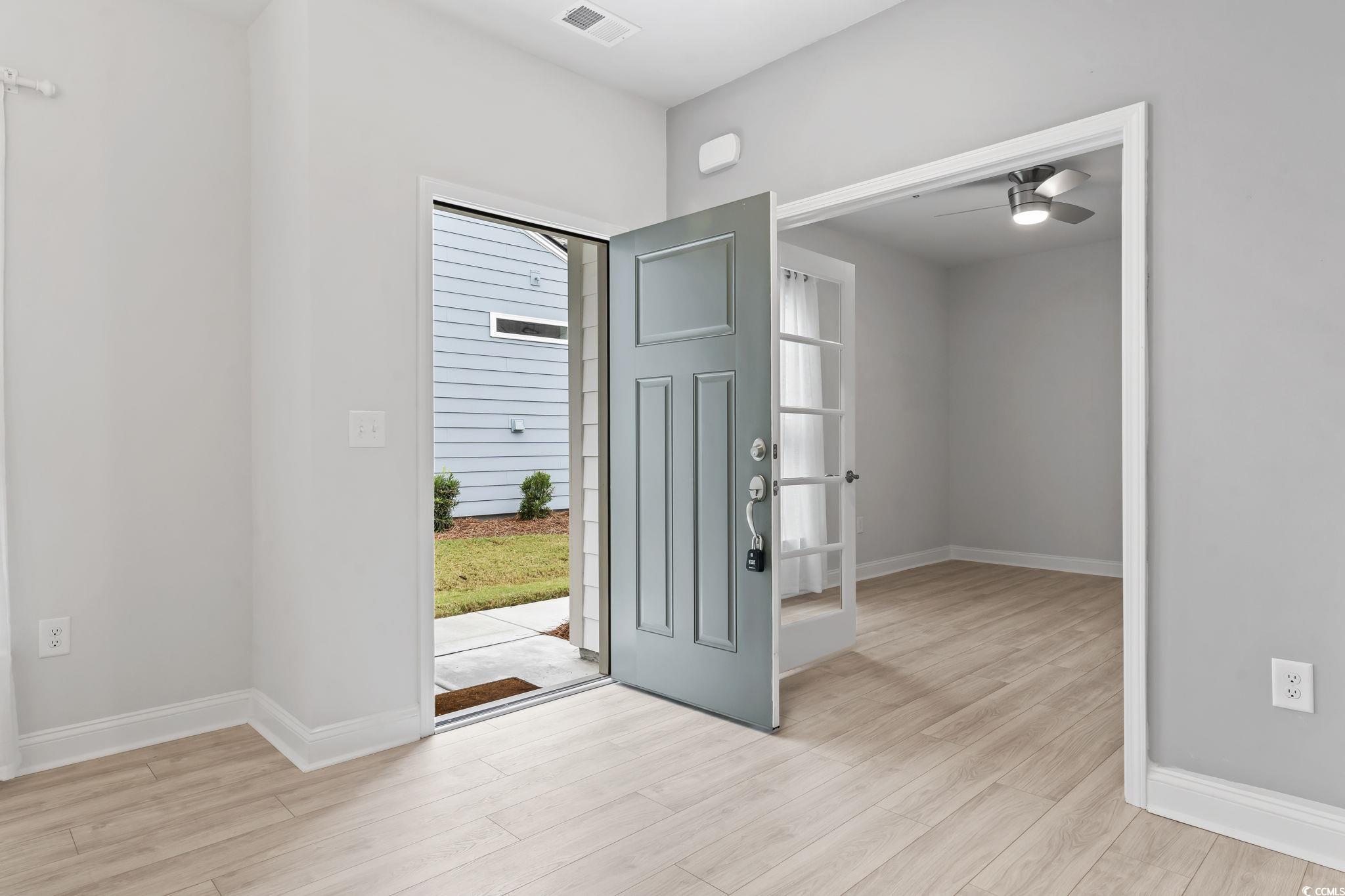 6570 Torino Lane Myrtle Beach, SC 29572 - Photo 13 of 25 entrance with a ceiling fan and light wood-style flooring