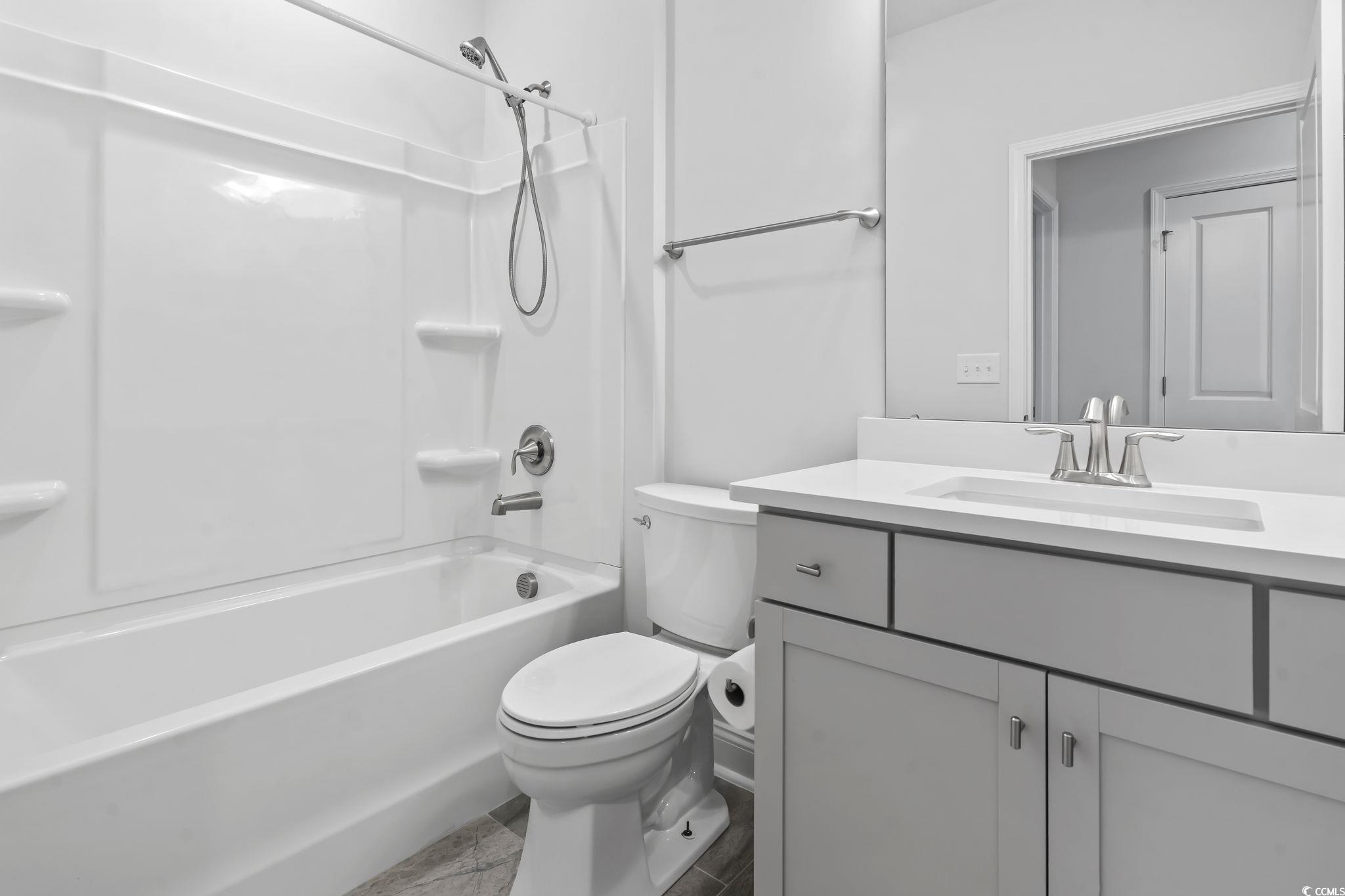 6570 Torino Lane Myrtle Beach, SC 29572 - Photo 7 of 25 Bathroom featuring tub / shower combination and vanity