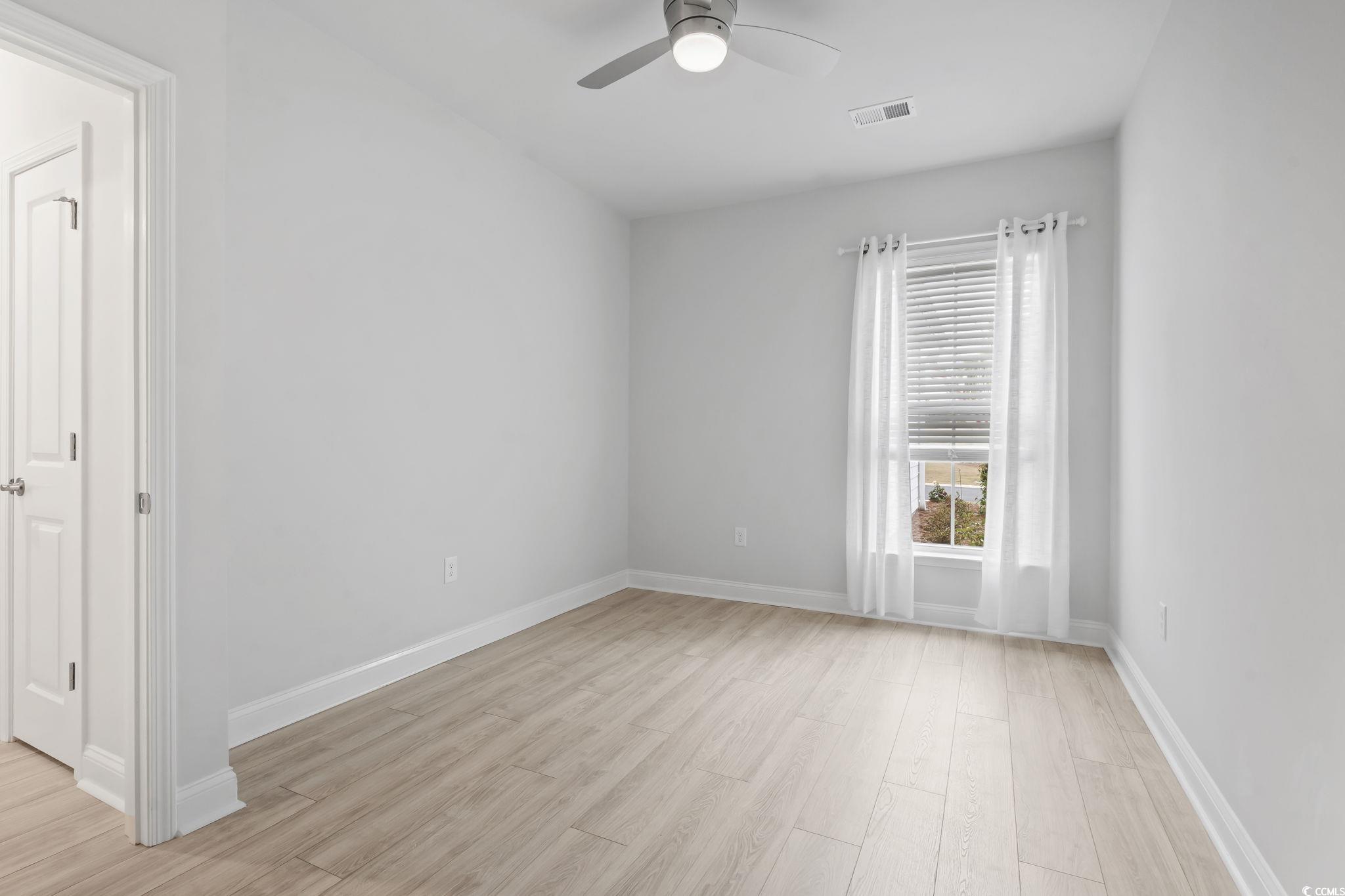 6570 Torino Lane Myrtle Beach, SC 29572 - Photo 9 of 25 room featuring light wood-style floors and ceiling fan, ideal for office or den.