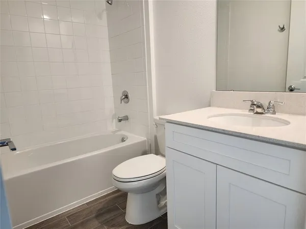 a bathroom with a sink a toilet and a bathtub