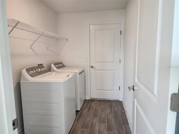 a utility room with dryer and washer