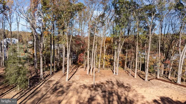 a view of outdoor space with wooden fence