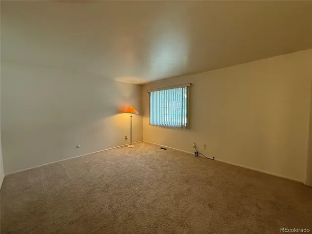 a bathroom with a granite countertop sink a large mirror and a shower