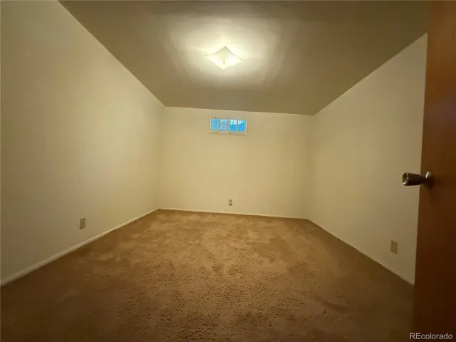 a bathroom with a sink mirror vanity and toilet