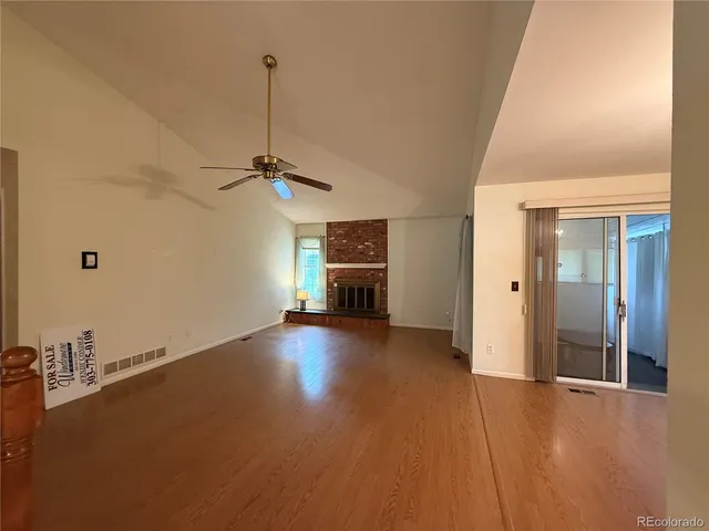 an empty room with a empty space and windows