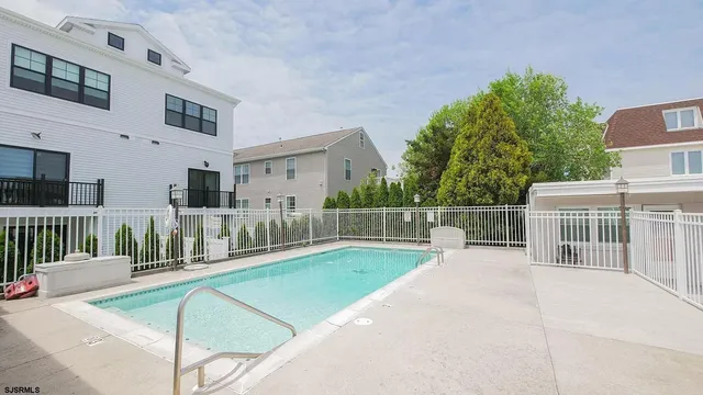 a view of a house with backyard and porch
