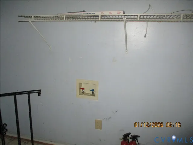 a view of a wall with racks on the wall