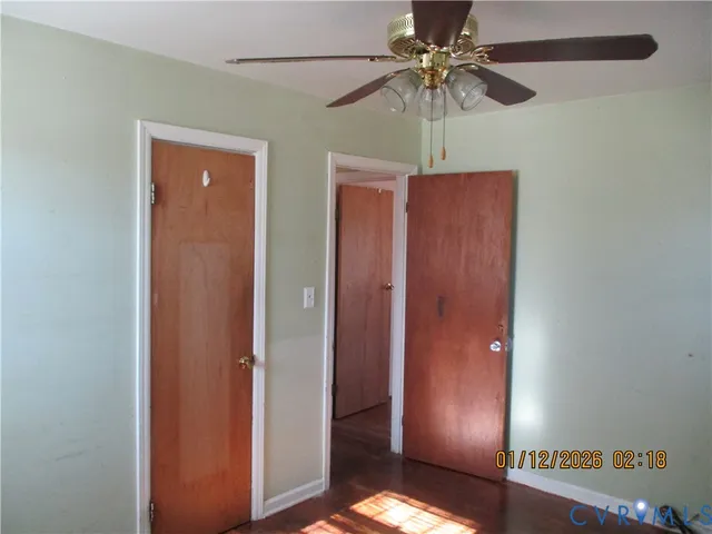 a view of a livingroom with a chandelier fan