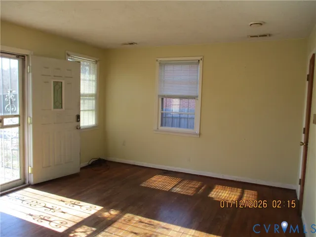 a view of an empty room and window